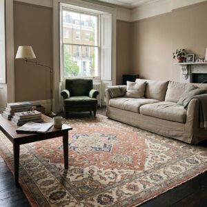 a beautiful, expensive hand-knotted rug in a cosy, genuinely lived-in Belgravia flat in London